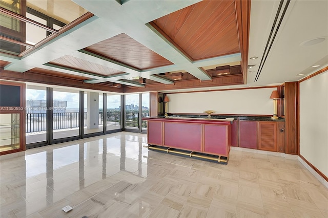 kitchen featuring beam ceiling, expansive windows, french doors, and coffered ceiling