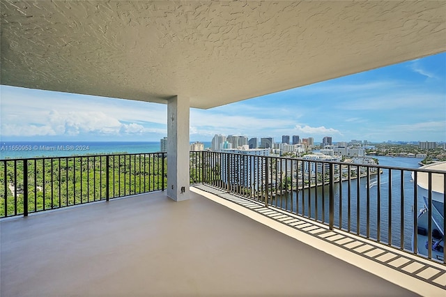 balcony featuring a water view