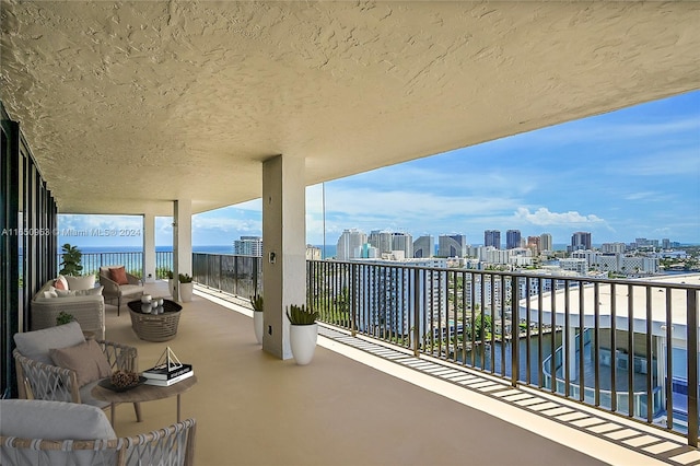 balcony featuring a water view