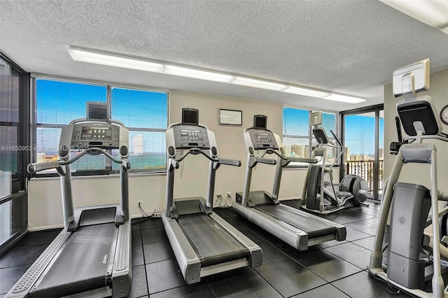 936 Intracoastal Dr Unit Ph4, Fort Lauderdale, FL 33304 - exercise room featuring a textured ceiling, healthy amount of natural light, and floor to ceiling windows