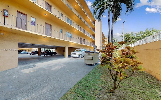 view of parking / parking lot featuring a carport