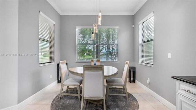 dining room featuring ornamental molding and light tile patterned floors