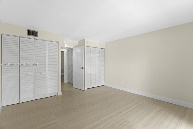 unfurnished bedroom featuring light hardwood / wood-style floors