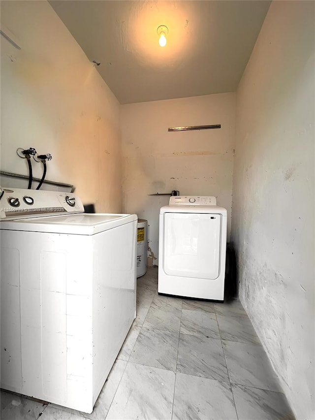 laundry room featuring washing machine and clothes dryer