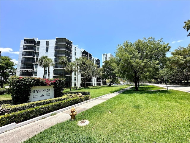 view of community featuring a lawn