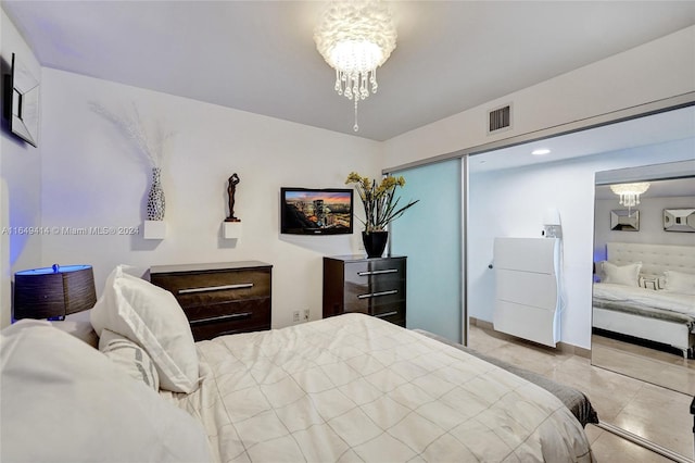 bedroom with an inviting chandelier