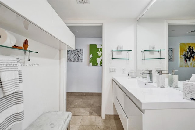 bathroom with tile patterned flooring and vanity