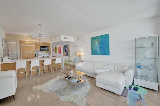 living room with a notable chandelier