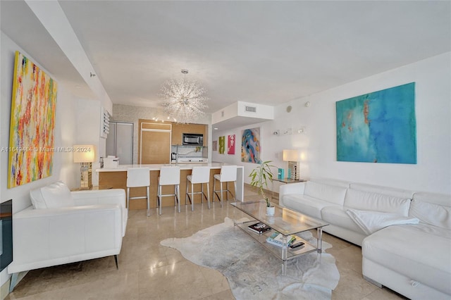 living room with an inviting chandelier