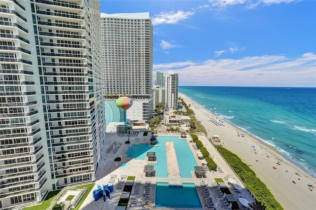 exterior space featuring a view of the beach and a water view