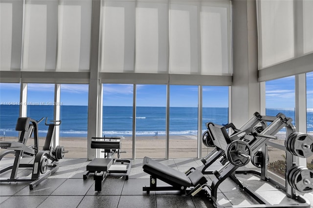 gym with a view of the beach and a water view