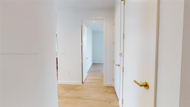 hallway with light wood-type flooring