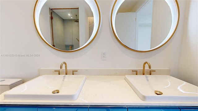 bathroom featuring vanity, toilet, and walk in shower