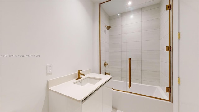 bathroom with enclosed tub / shower combo and vanity