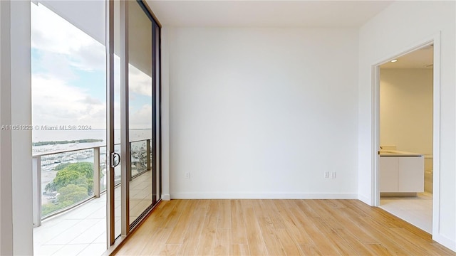 spare room featuring light hardwood / wood-style floors