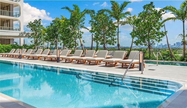 view of swimming pool featuring a patio area