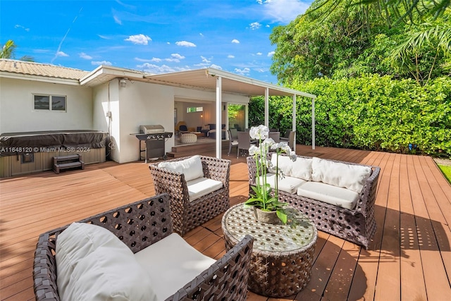 deck featuring outdoor lounge area, a hot tub, and area for grilling