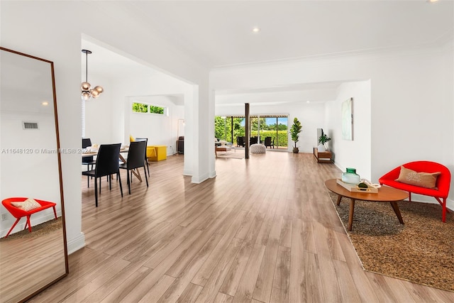 interior space featuring light hardwood / wood-style flooring and ornamental molding