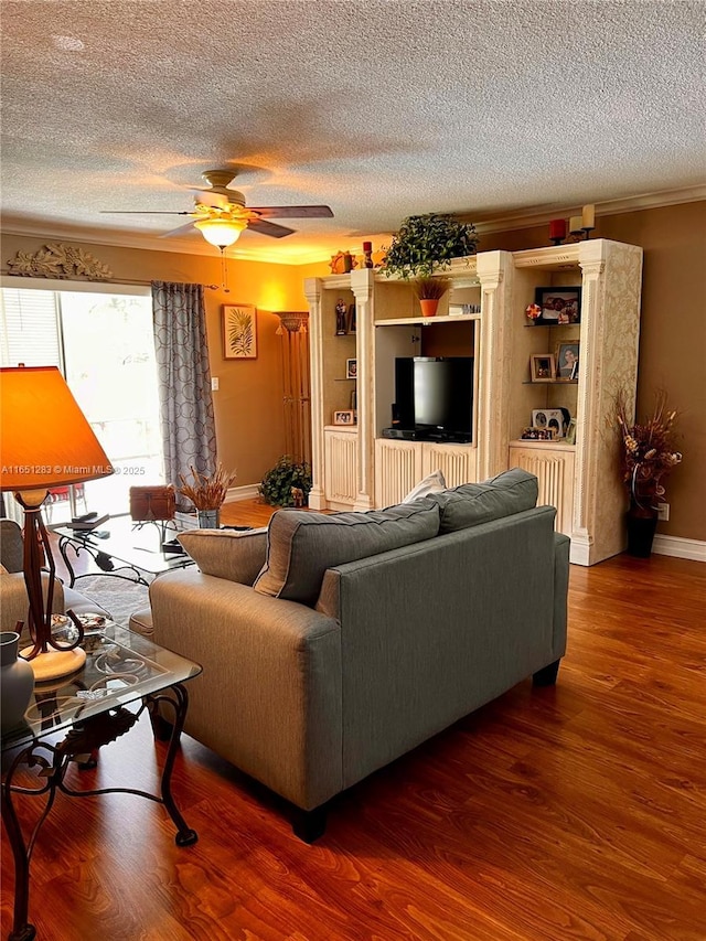 700 Layne Blvd Unit 212, Hallandale Beach, FL 33009 - living area featuring a ceiling fan, a textured ceiling, wood finished floors, crown molding, and baseboards