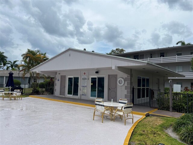 700 Layne Blvd Unit 212, Hallandale Beach, FL 33009 - rear view of house featuring a patio and stucco siding