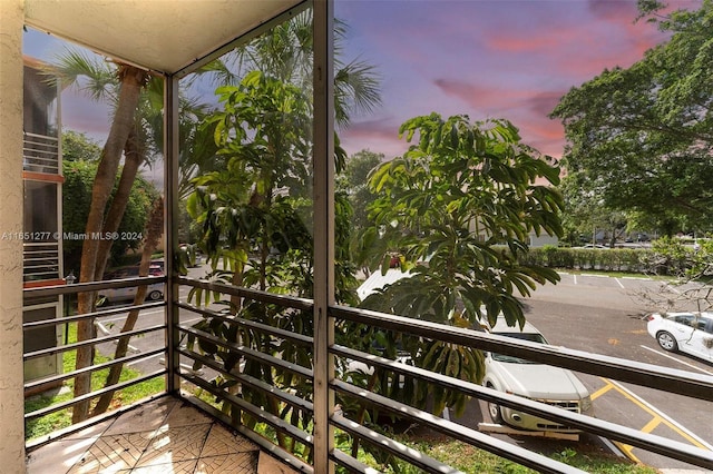 view of balcony at dusk