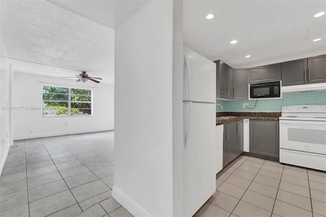 kitchen featuring white appliances, sink, decorative backsplash, ceiling fan, and light tile patterned flooring