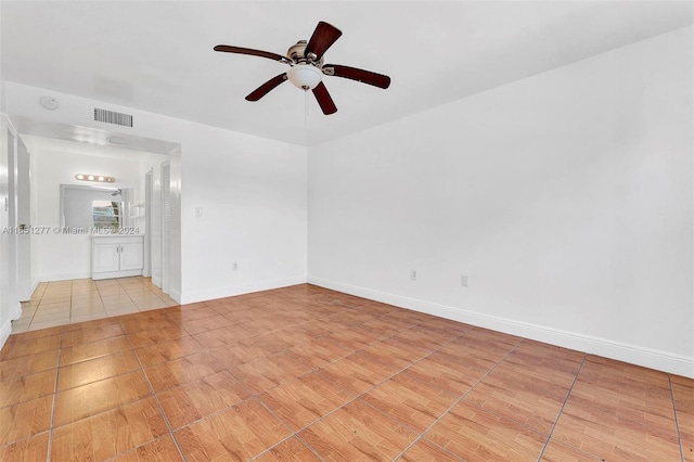 unfurnished room featuring ceiling fan and light tile patterned flooring