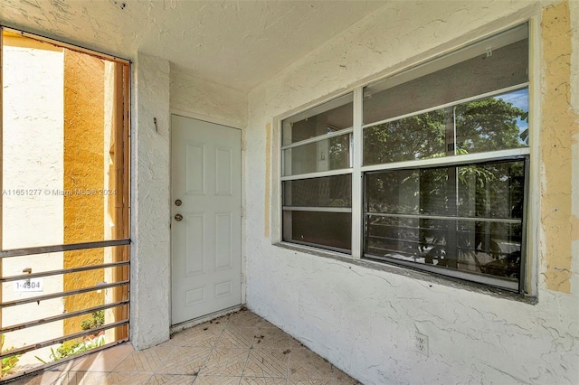 property entrance with a balcony