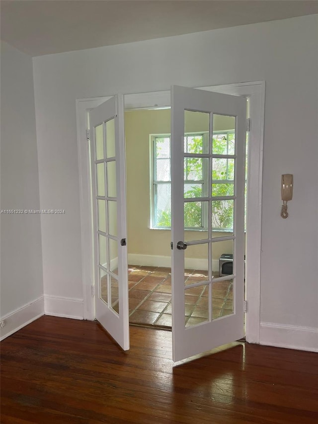 754 Meridian Ave Unit 15, Miami Beach, FL 33139 - doorway with french doors, baseboards, and hardwood / wood-style flooring