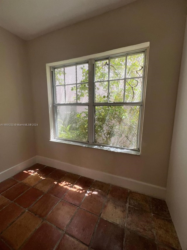 754 Meridian Ave Unit 15, Miami Beach, FL 33139 - tiled spare room with baseboards