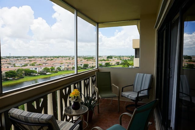 balcony featuring a water view