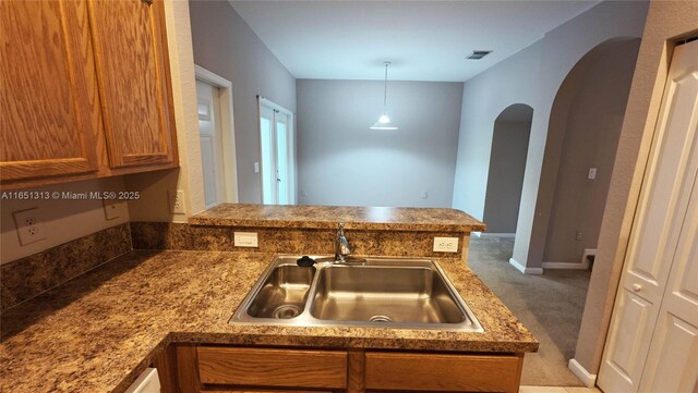 kitchen featuring light tile patterned floors, light stone counters, and white appliances