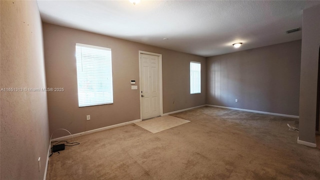 recreation room with carpet flooring