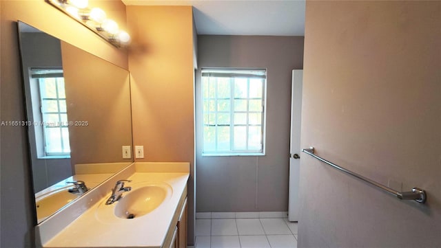 carpeted bedroom with two closets and a tray ceiling