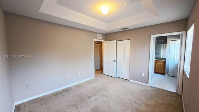 carpeted bedroom featuring a closet