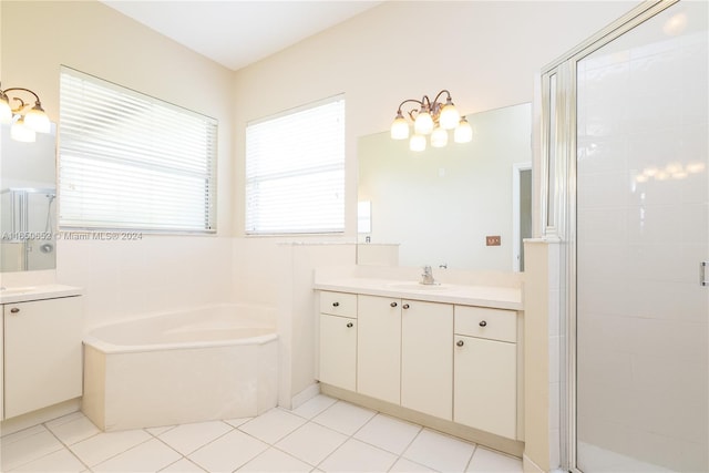 bathroom featuring vanity, tile patterned floors, and plus walk in shower