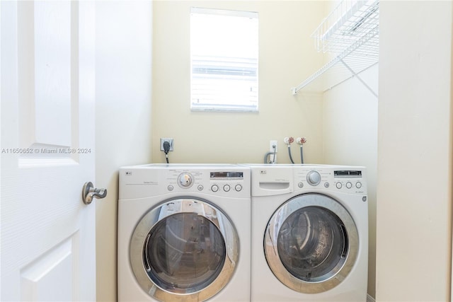 clothes washing area featuring independent washer and dryer