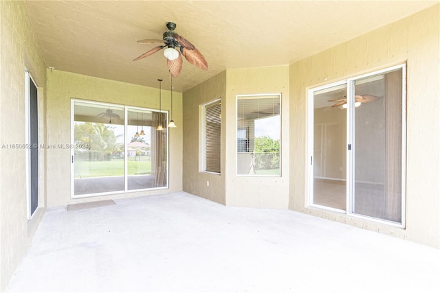 view of patio featuring ceiling fan