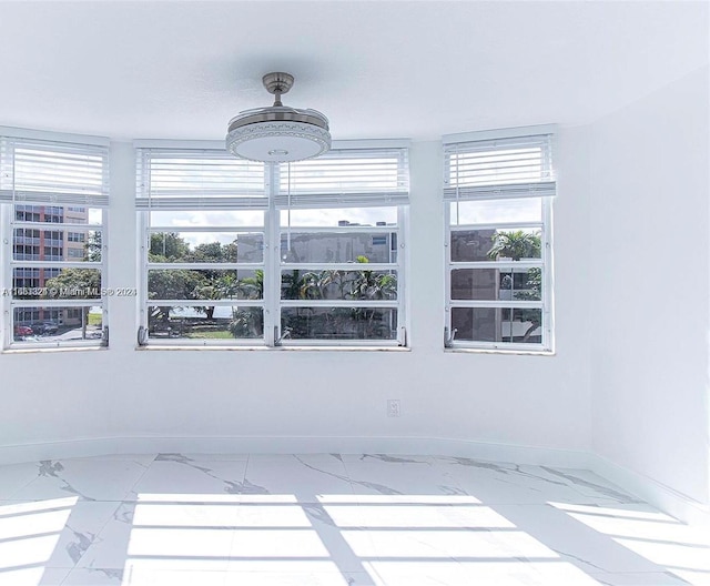 empty room featuring plenty of natural light