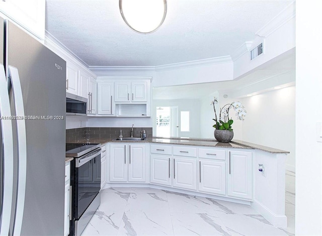 kitchen with crown molding, white cabinetry, stainless steel appliances, and sink