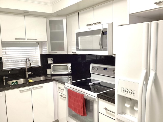 611 S Hollybrook Dr Unit 102, Pembroke Pines, FL 33025 - kitchen with white appliances, a sink, white cabinets, glass insert cabinets, and backsplash