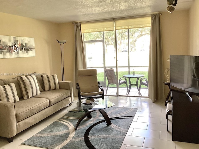 611 S Hollybrook Dr Unit 102, Pembroke Pines, FL 33025 - living room with a textured ceiling, light tile patterned floors, and floor to ceiling windows