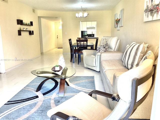 611 S Hollybrook Dr Unit 102, Pembroke Pines, FL 33025 - living area with a chandelier, light tile patterned floors, and baseboards