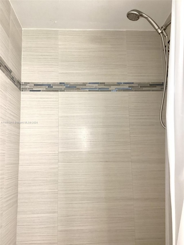 interior space featuring a tile shower