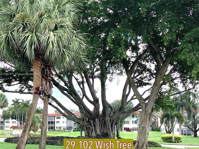 611 S Hollybrook Dr Unit 102, Pembroke Pines, FL 33025 - view of community featuring a lawn