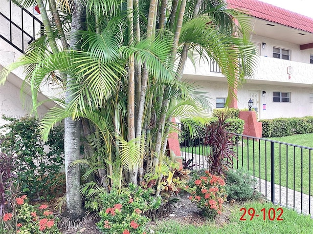 611 S Hollybrook Dr Unit 102, Pembroke Pines, FL 33025 - view of side of home with stucco siding and a tiled roof