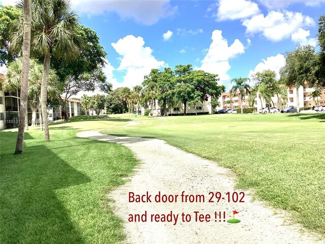 611 S Hollybrook Dr Unit 102, Pembroke Pines, FL 33025 - view of property's community featuring a lawn, a residential view, and golf course view