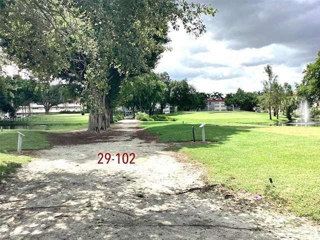 611 S Hollybrook Dr Unit 102, Pembroke Pines, FL 33025 - view of community with a lawn