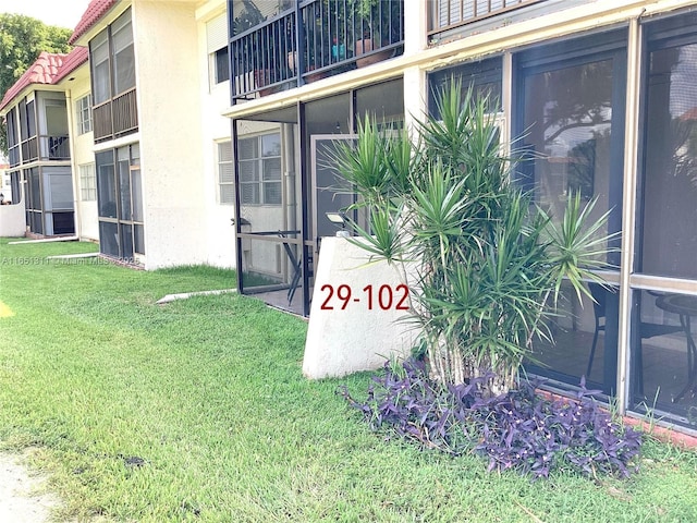 611 S Hollybrook Dr Unit 102, Pembroke Pines, FL 33025 - entrance to property with a lawn and stucco siding