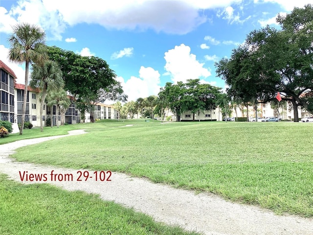 611 S Hollybrook Dr Unit 102, Pembroke Pines, FL 33025 - view of home's community with a yard